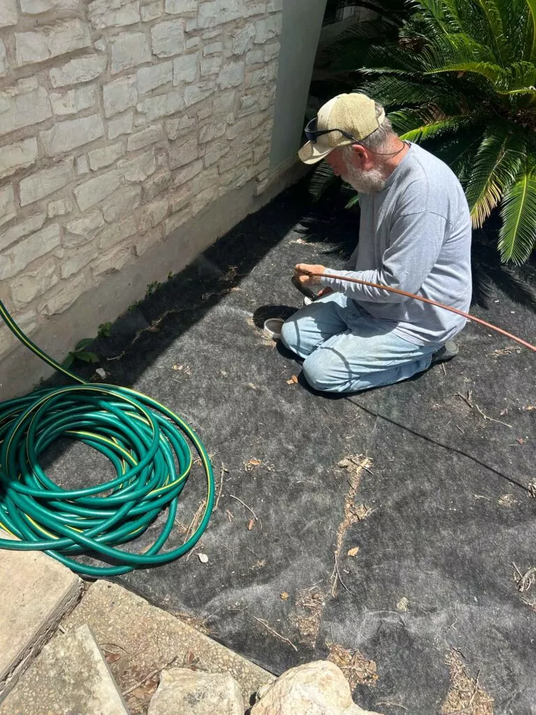 Dave Flynn the owner of SewerTV Inc using a hydrojet on a clogged drain