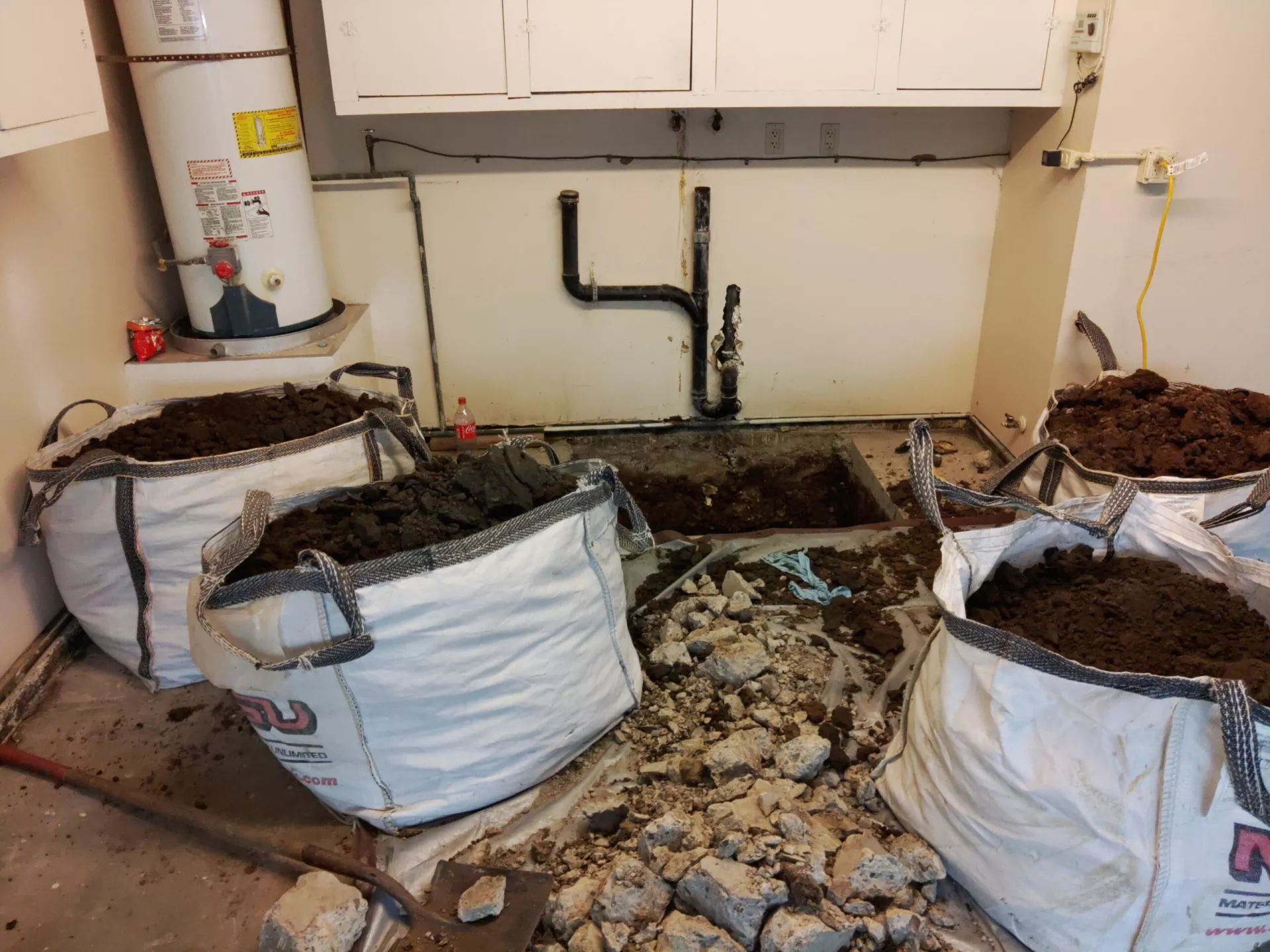 Digging up Sewer pipe to repair it