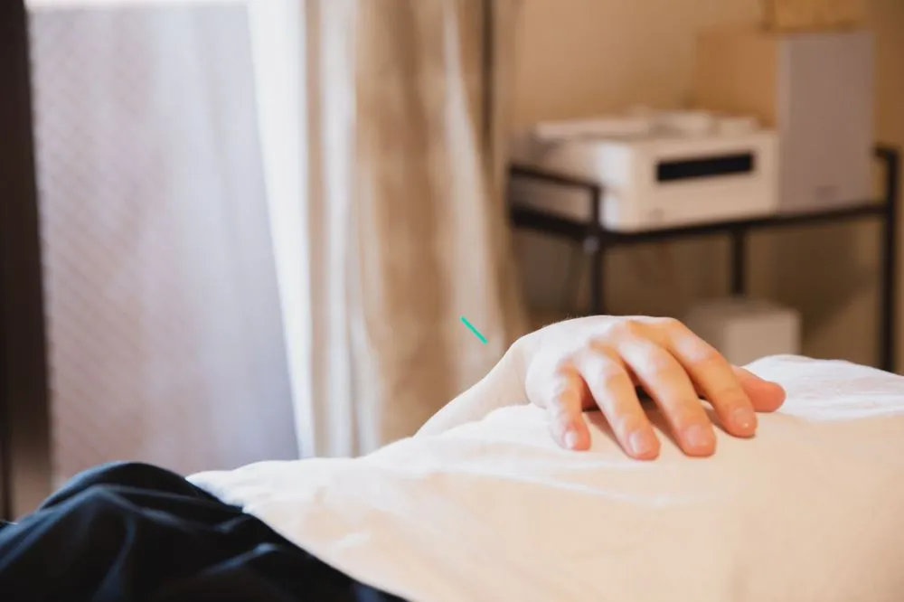 Botox for Chronic Migraines in Plano, TX | Relief Guide 4 Patient resting comfortably in pain clinic treatment room after outpatient procedure