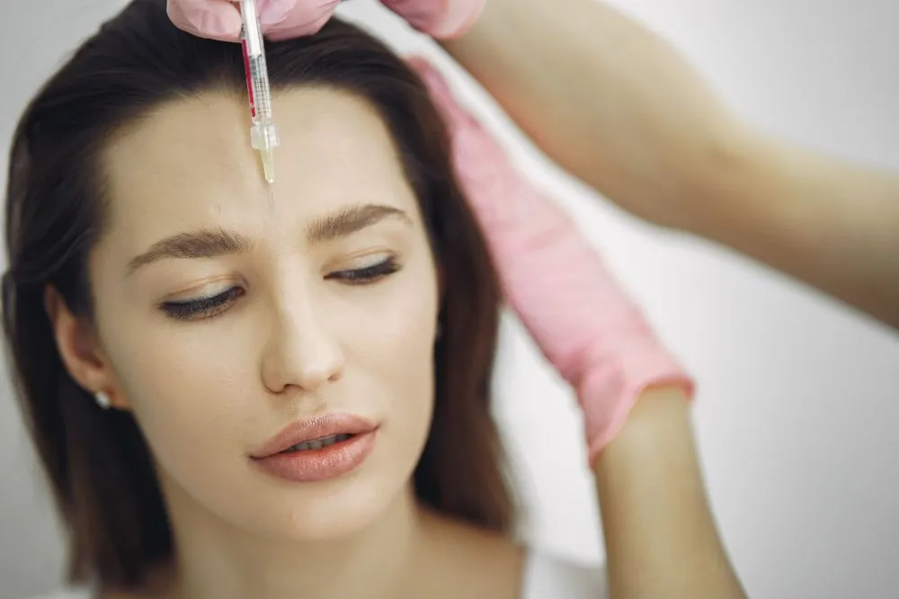Botox for Chronic Migraines in Grand Prairie, TX 3 Medical professional administering Botox injection for chronic migraine treatment