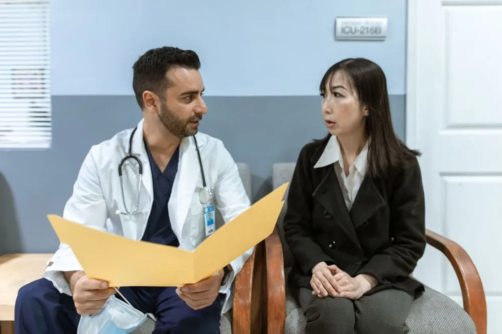 Botox for Chronic Migraines in Plano, TX 2 Interventional pain management doctor consulting with patient about migraine treatment options