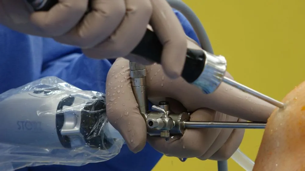 Chronic Low Back Pain: Is Your Treatment Worth the Risk? 3 Physician performing radiofrequency ablation procedure using fluoroscopy guidance for back pain