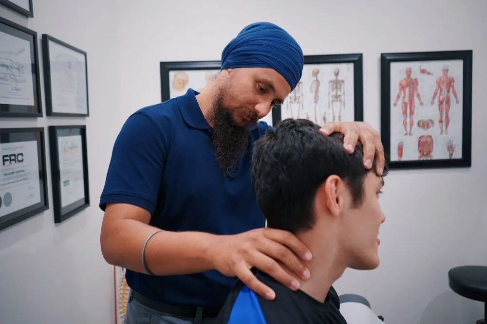 Group Therapy & Stem Cell Care for Chronic Pain in Plano, TX 2 Pain management specialist reviewing a treatment plan with a chronic pain patient