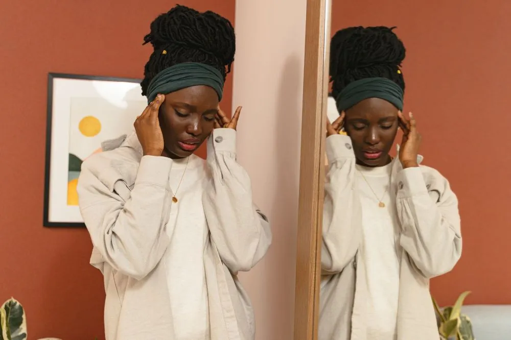 AI Discovers New Non-Opioid Pain Drug | Plano, TX 1 Woman holding her temples experiencing chronic migraine headache pain