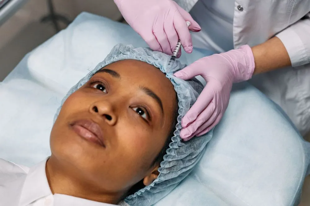AI Discovers New Non-Opioid Pain Drug | Plano, TX 3 Clinician administering Botox injection for chronic migraines in a medical setting