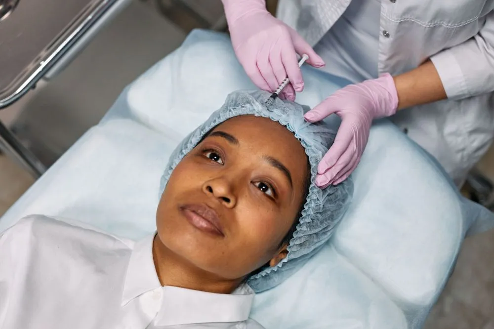 Melatonin & Botox for Chronic Migraines in Grand Prairie, TX 3 Medical professional administering Botox injection to a patient for chronic migraine treatment