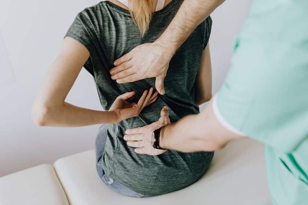 Opioid Taper & Botox for Migraines in Grand Prairie, TX 3 Patient discussing non-opioid pain treatment options with a specialist at Grand Prairie clinic