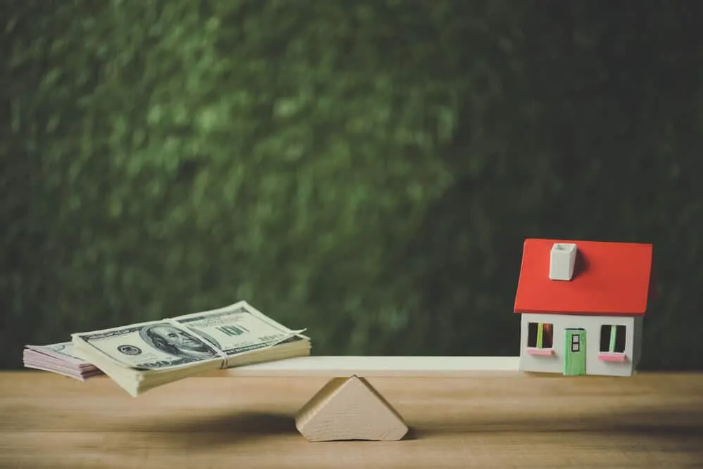 Dollar banknotes and house model - Sprint Funding