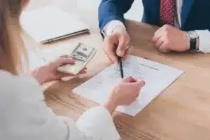 Signing a loan application - Sprint Funding