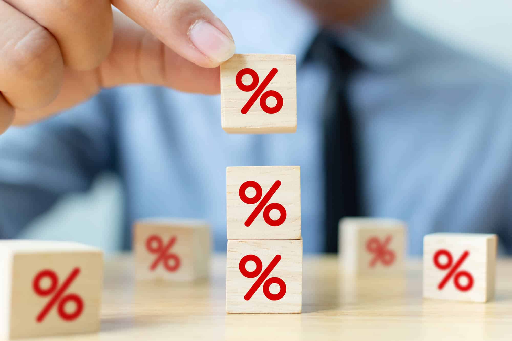 Man holding cubes of interest rate risk
