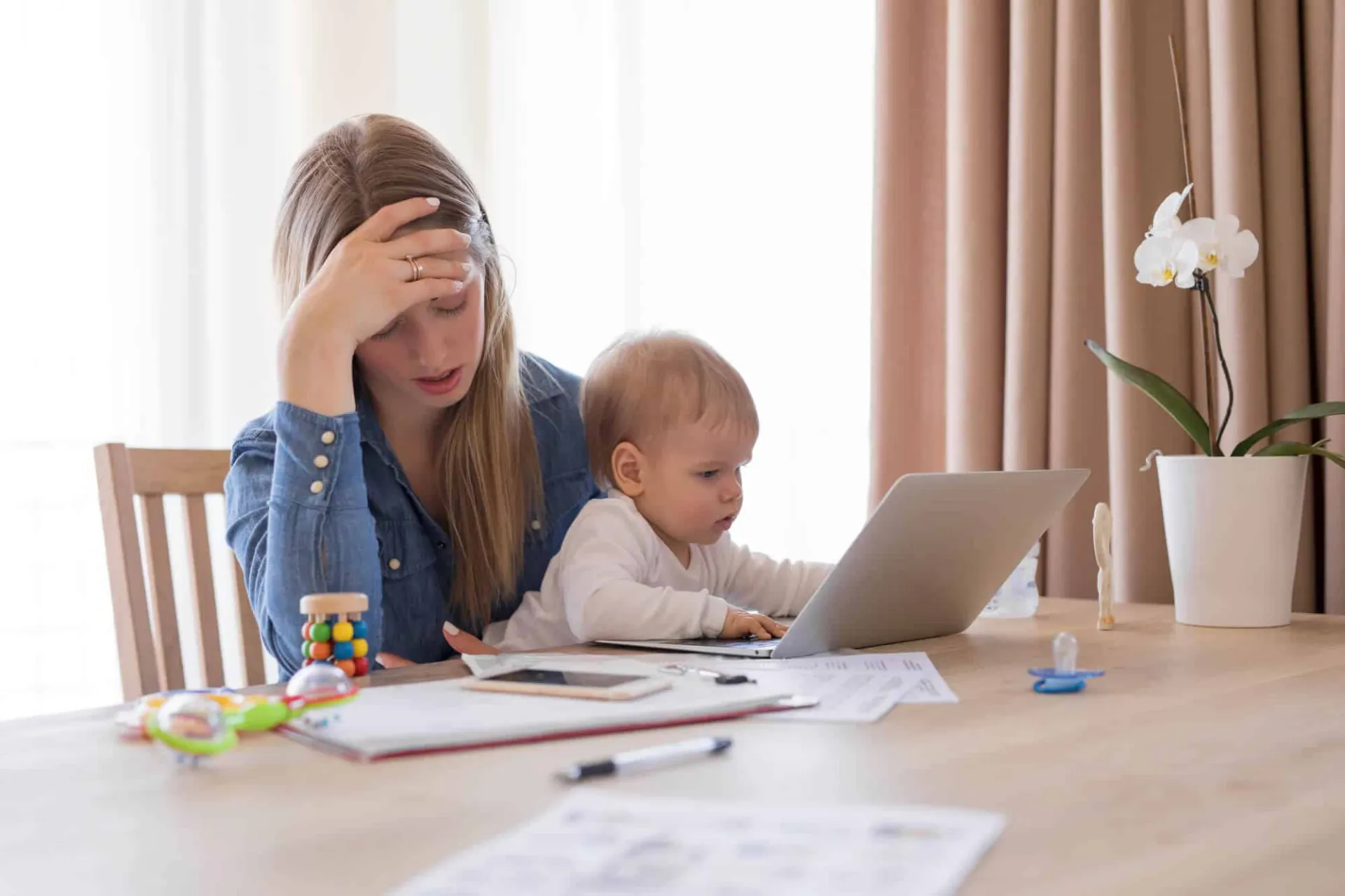 Women holding her baby worrying about loans