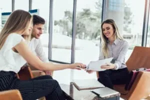 Homebuyer consulting with a mortgage loan advisor about FHA loan options.
