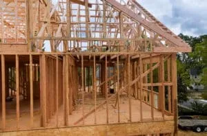Partially framed new home construction funded through a construction loan.