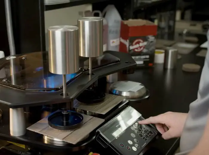 RTS 1 Rating SPC Flooring: Next-Gen Scratch Resistance Martindale Lab instrument with 38N weights.