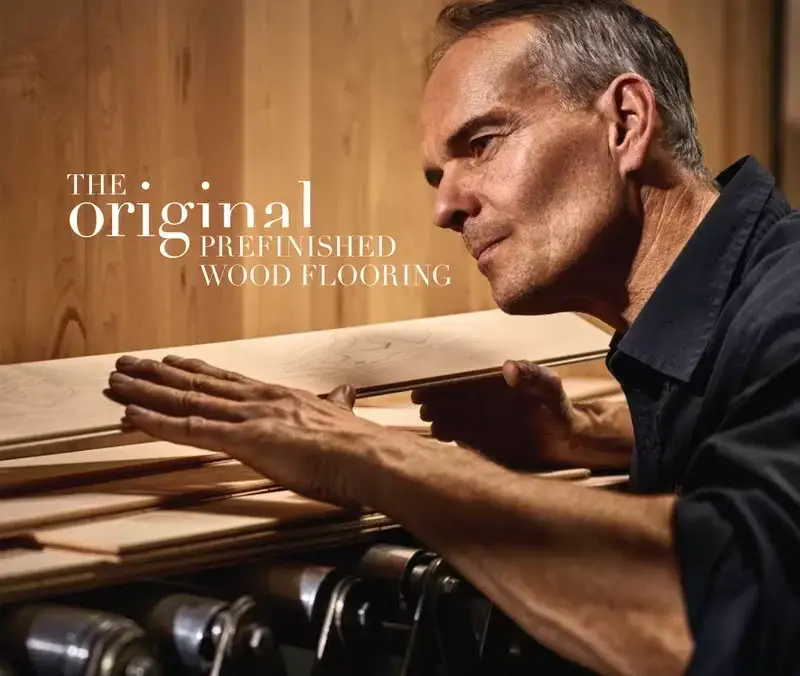 Floor Covering Weekly -Industry Overview & Key Trends Man examining prefinished wood flooring