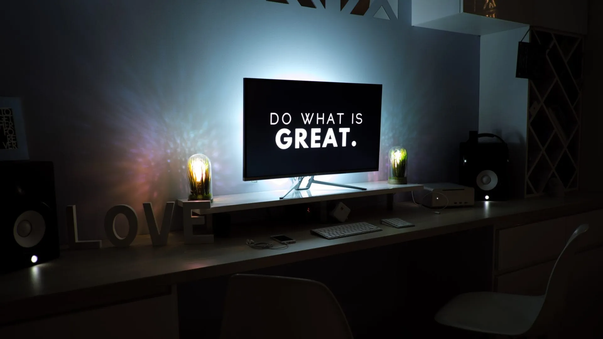 A desk with a computer and a lamp for a social media manager working on digital marketing strategies. A desk with a computer and a lamp for a social media manager working on digital marketing strategies.