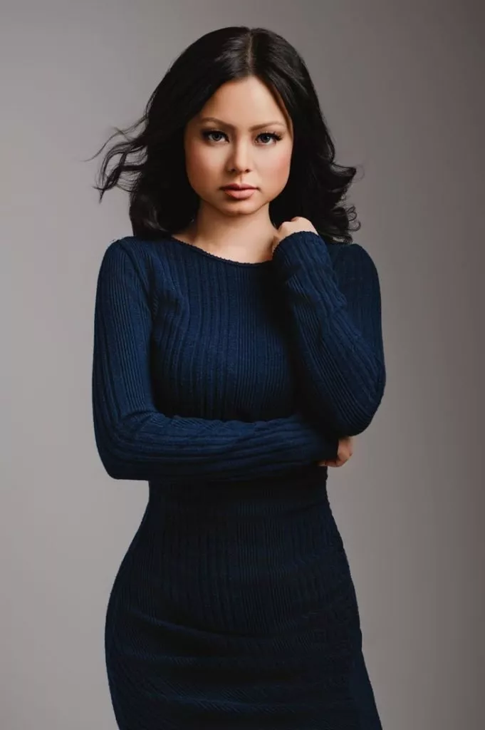 Portrait of a woman wearing a blue dress