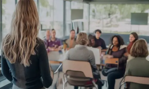 Woman Standing In Front Of A Class