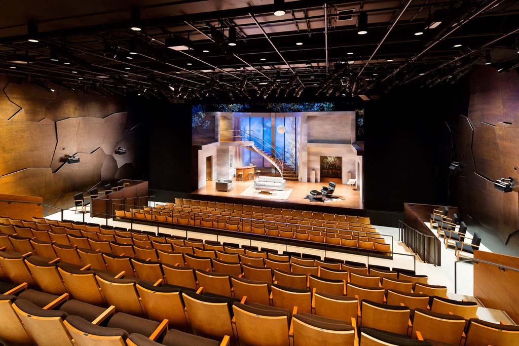 Contemporary theater with an intimate stage setup and modern lighting.