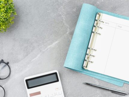 open-blue-notebook-office-desk