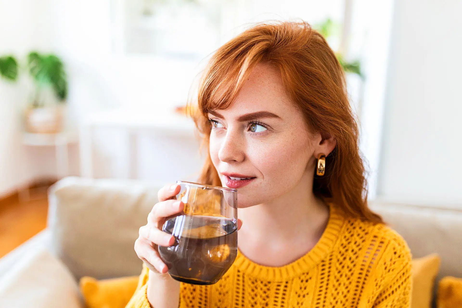 Drinking water. Happy young woman smiling while holding a glass of water-02 Drinking water. Happy young woman smiling while holding a glass of water