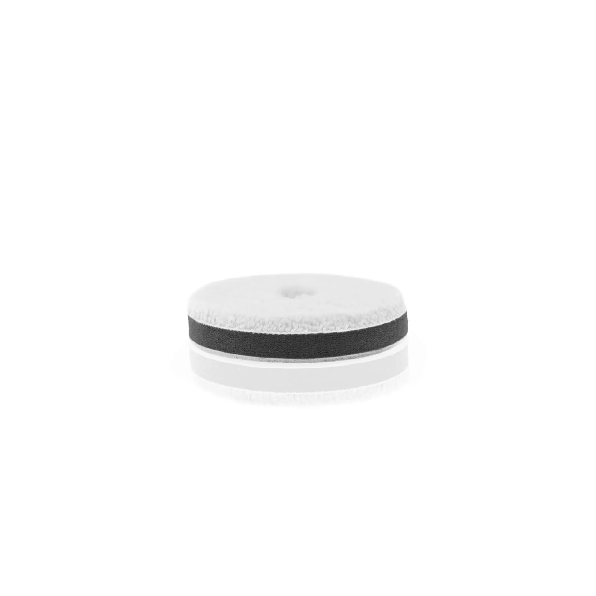 A round foam pad with black and white layered sections, suitable for car cleaning, shown against a plain white background.