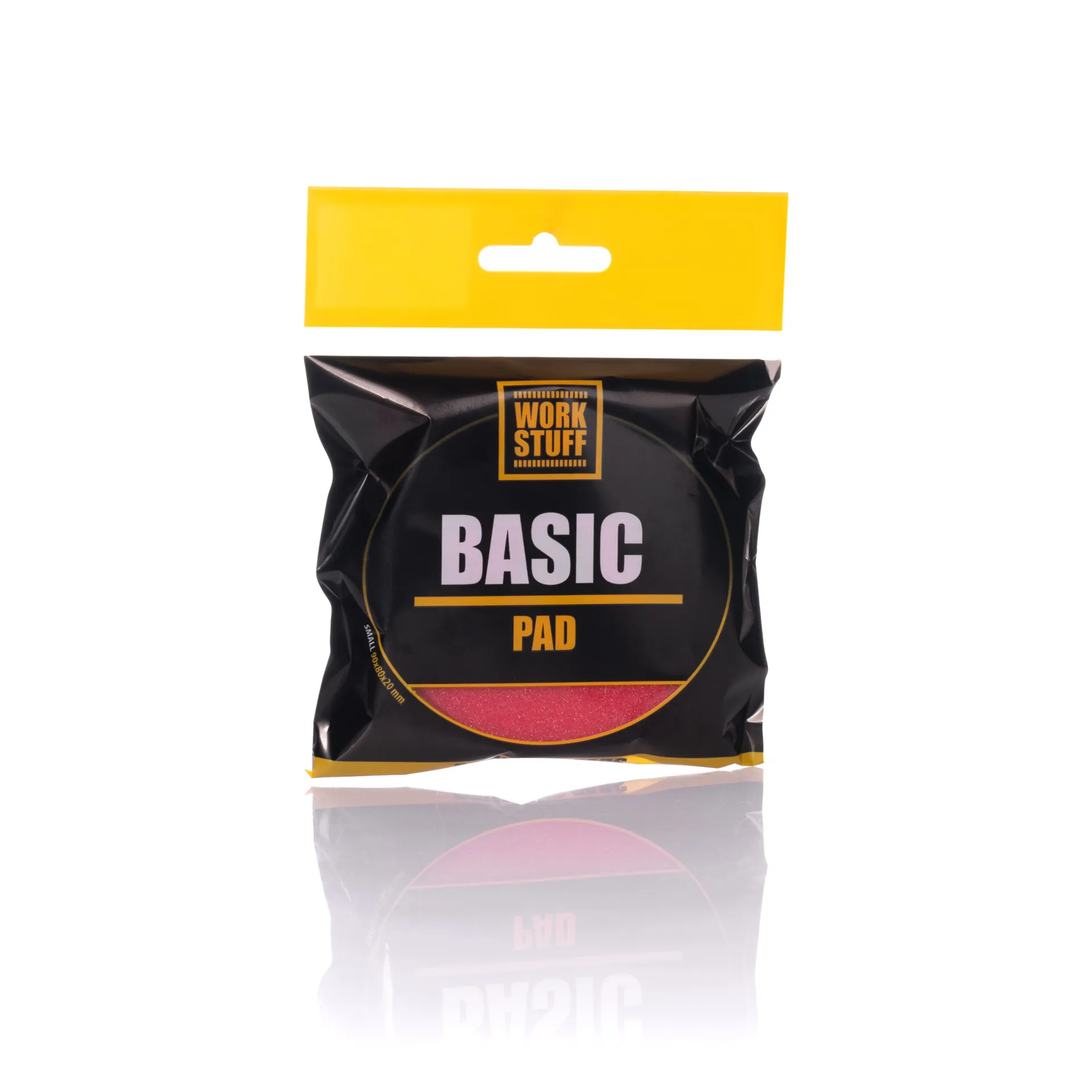 Work Stuff Basic Pad package upright on white, black with yellow accents and clear window showing a red pad inside.