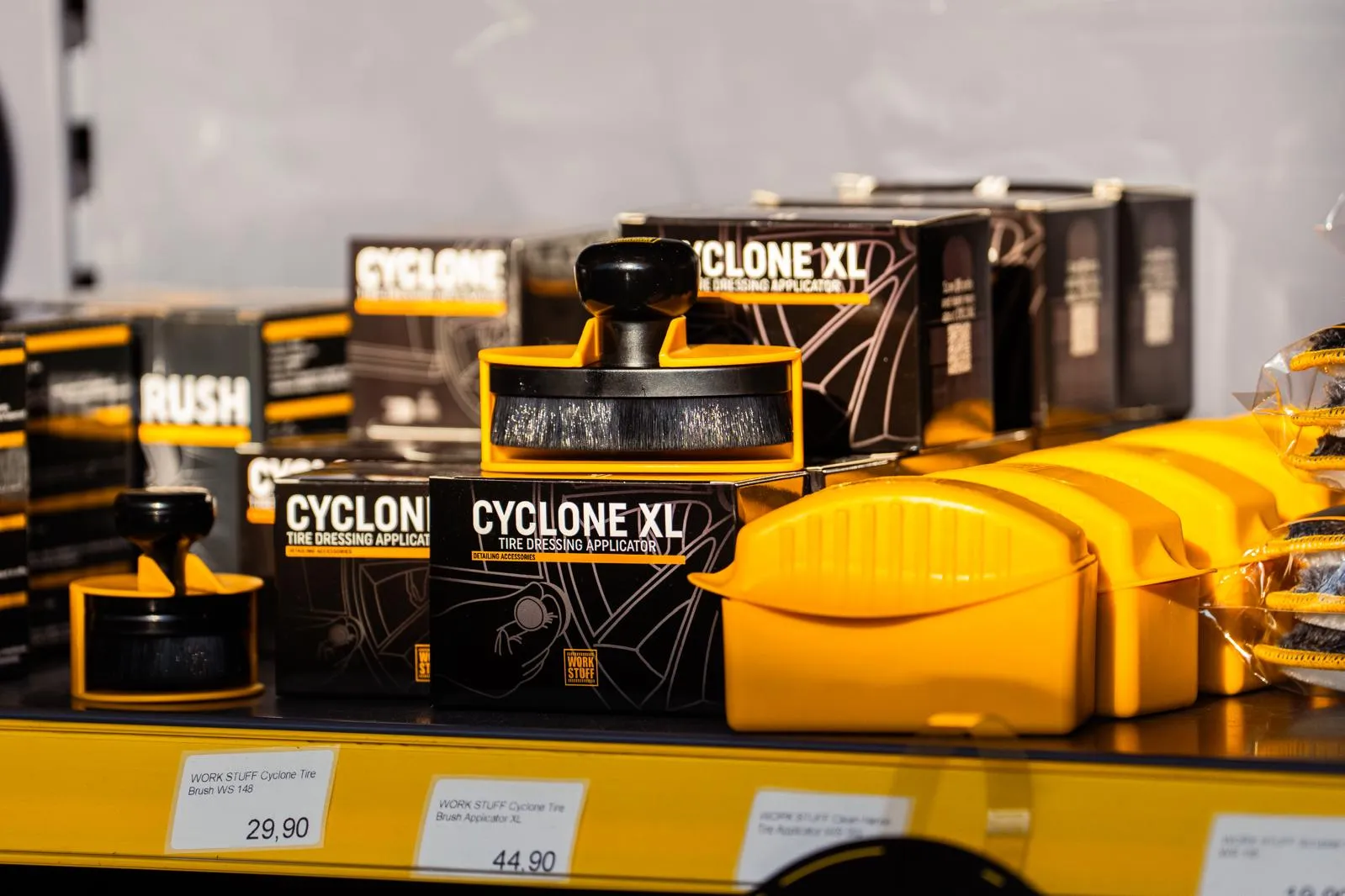 Work Stuff CYCLONE XL yellow-handled tire applicators on a shelf in Gdańsk, black and yellow boxes, price tags below.