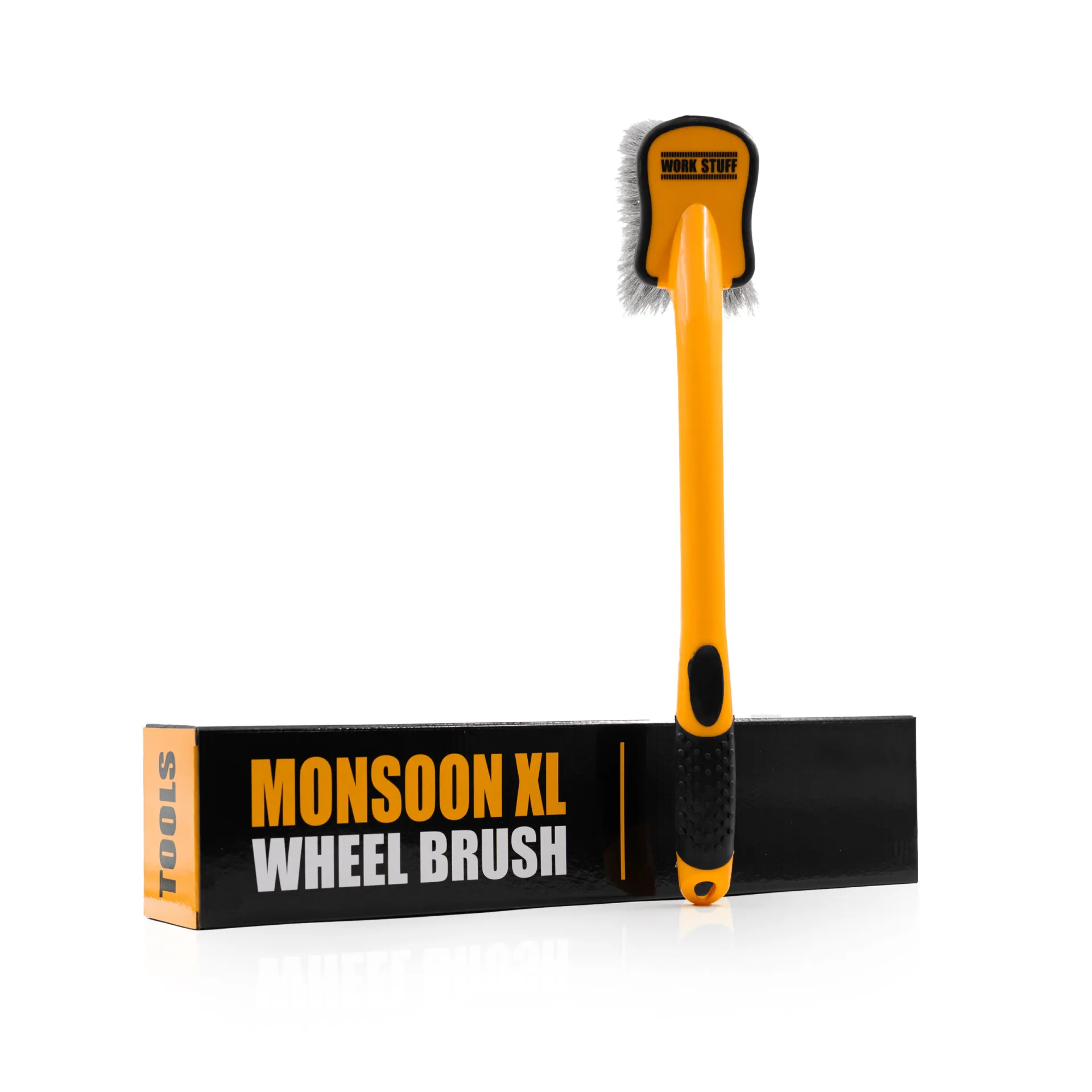 A yellow and black Work Stuff wheel brush stands on a black box labeled MONSOON XL WHEEL BRUSH in bold yellow and white text.