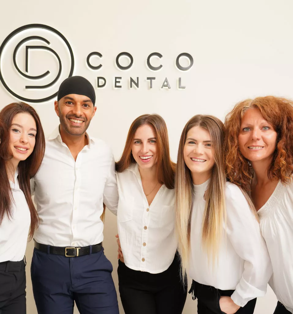 Homepage 6 cocodental dentist examining teeth during routine checkup COCO Dental 06846 copy e1743428991379 cocodental modern dental clinic providing professional care in uk