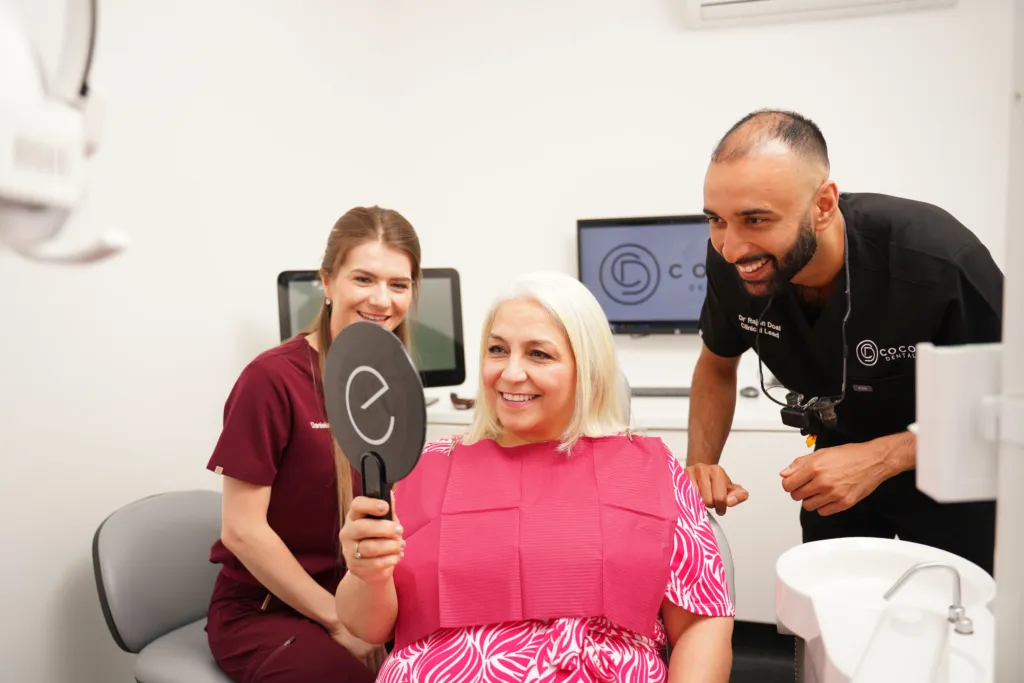 Homepage 11 cocodental dentist examining teeth during routine checkup COCO Dental 07928 copy cocodental modern dental clinic providing professional care in uk