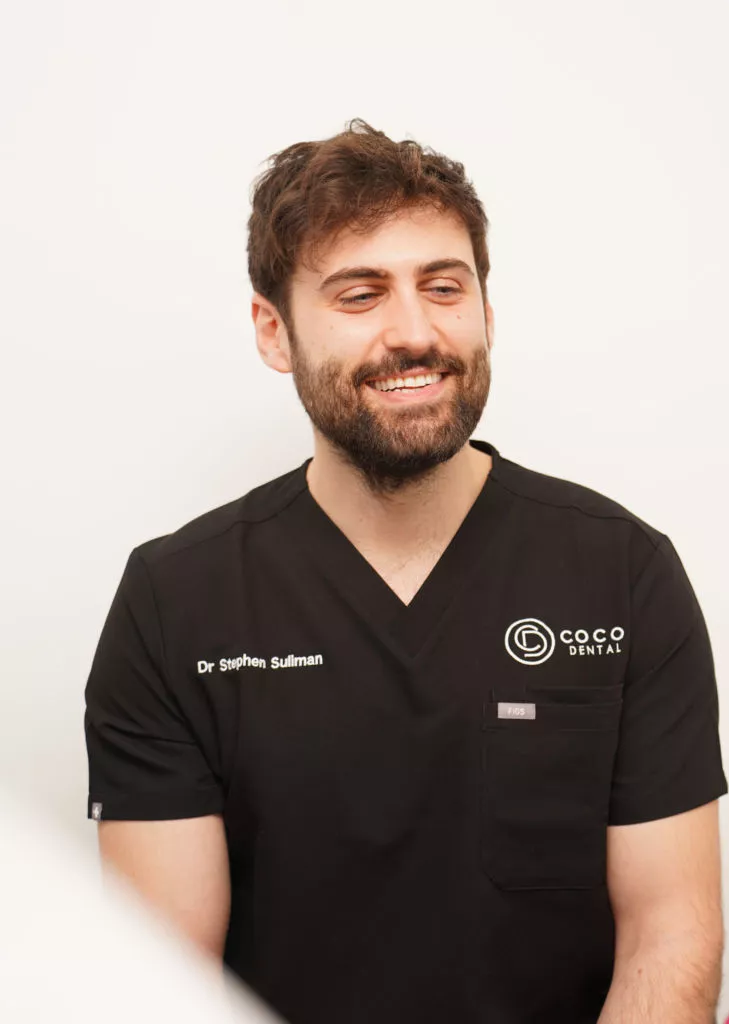 Homepage 9 cocodental dentist examining teeth during routine checkup COCO Dental 08244 e1746032136590 cocodental modern dental clinic providing professional care in uk