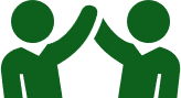 Two green silhouettes high-fiving each other, symbolizing teamwork and success.