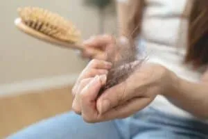 Finasteride For Women hair loss in women on brush