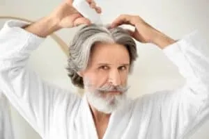 RU58841 For Hair Loss topical serum for hair loss applied by an older man
