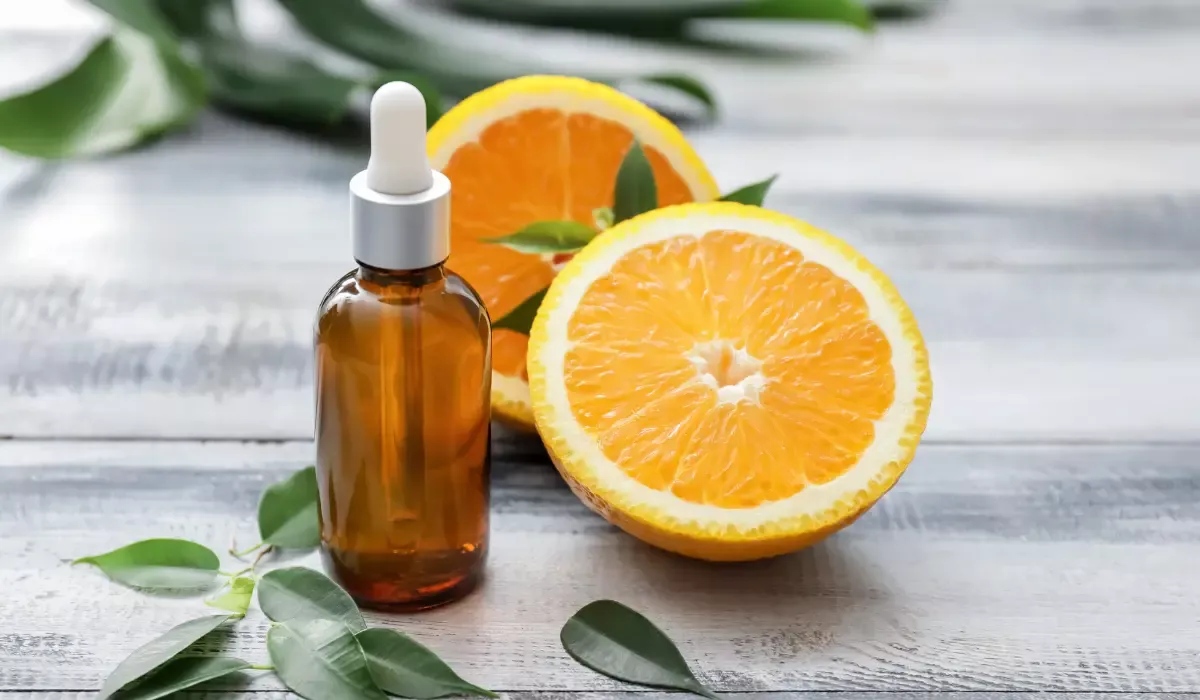 Bottle of Orange Essential Oil on Table