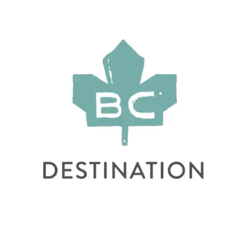 A teal maple leaf with the letters "BC" inside is above the word "DESTINATION" in capital letters, representing vacation rental management in Harrison Hot Springs, all set on a white background.