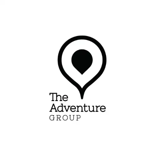 Black and white logo featuring a location pin icon above the words "The Adventure Group" in a clean, modern font, perfect for vacation rental management in Whistler.