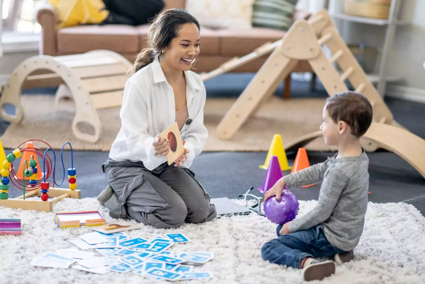 Child learning from a behavior specialists through aba therapy and its benefits