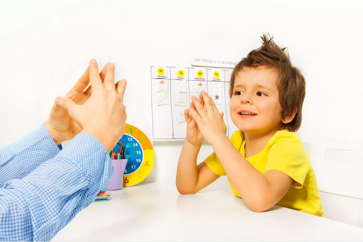 Boy in yellow getting ABA therapy with a provider. Medicaid insurance is changing in florida. ABA therapy providers are being affected. Mestre Behavior is in network with many.