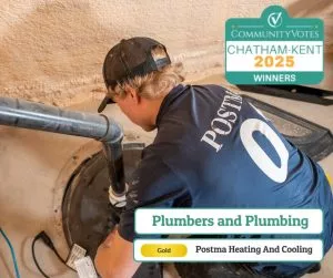 Postma technician performing plumbing work, winner of Chatham-Kent 2025 Plumbers and Plumbing Services Gold Award