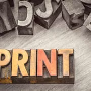 Stylized graphic showing the word PRINT using printer blocks.