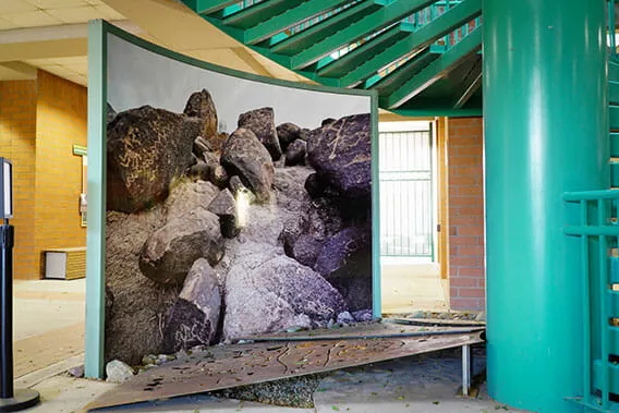 Curved graphics display featuring geological photography.