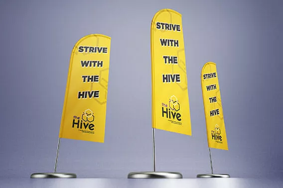 Three feather flags with text saying "Strive with the Hive" printed in school colors.