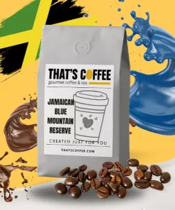 A bag of That's Coffee Jamaican Blue Mountain Reserve is displayed with Jamaican coffee beans, chocolate, blue liquid splashes, and a Jamaican flag in the background.
