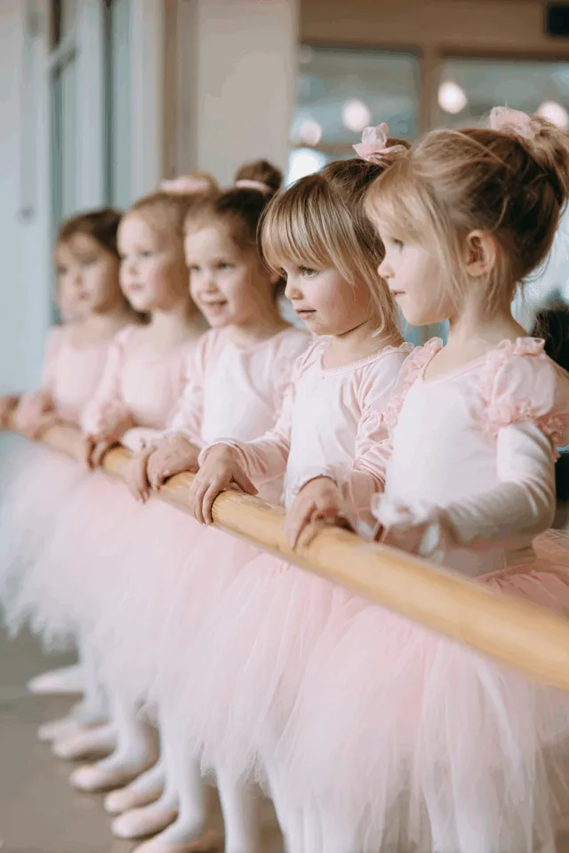 https://berqwp-cdn.sfo3.cdn.digitaloceanspaces.com/cache/www.ucofballet.com/wp-content/uploads/2025/11/d001o_Small_age_3-4_girls_dressed_as_ballerinas_next_to_balle_8dda7b6e-a141-438c-82c1-da2734131ed0_1-640x960-png.webp?bwp
