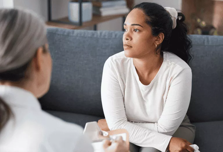 a person talks to a therapist about detox program faq