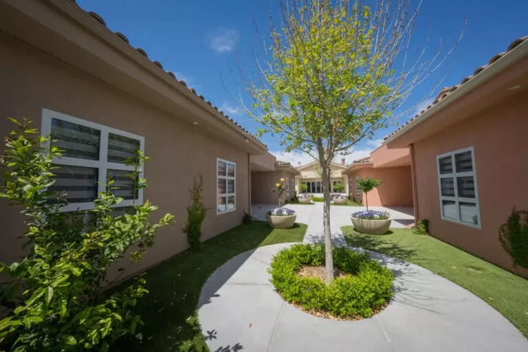 Corbett Walkway Between Villas with Tree | Virtue Recovery Las Vegas Corbett Walkway Between Villas with Tree