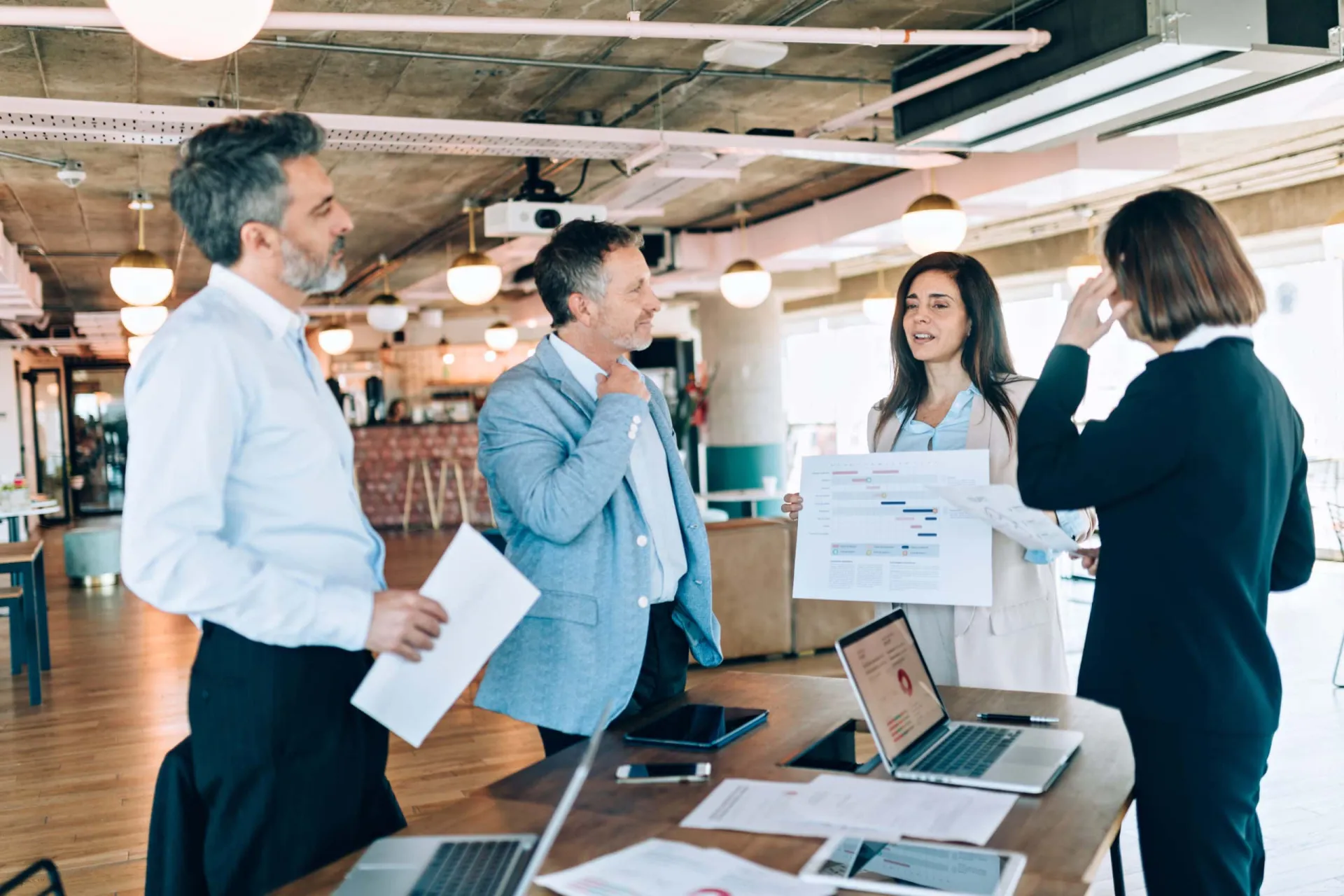 Lead Scoring Strategy Meeting Business professionals discussing lead scoring in a modern office setting.