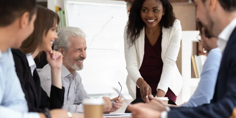 Team meeting showcasing company transparency and teamwork.